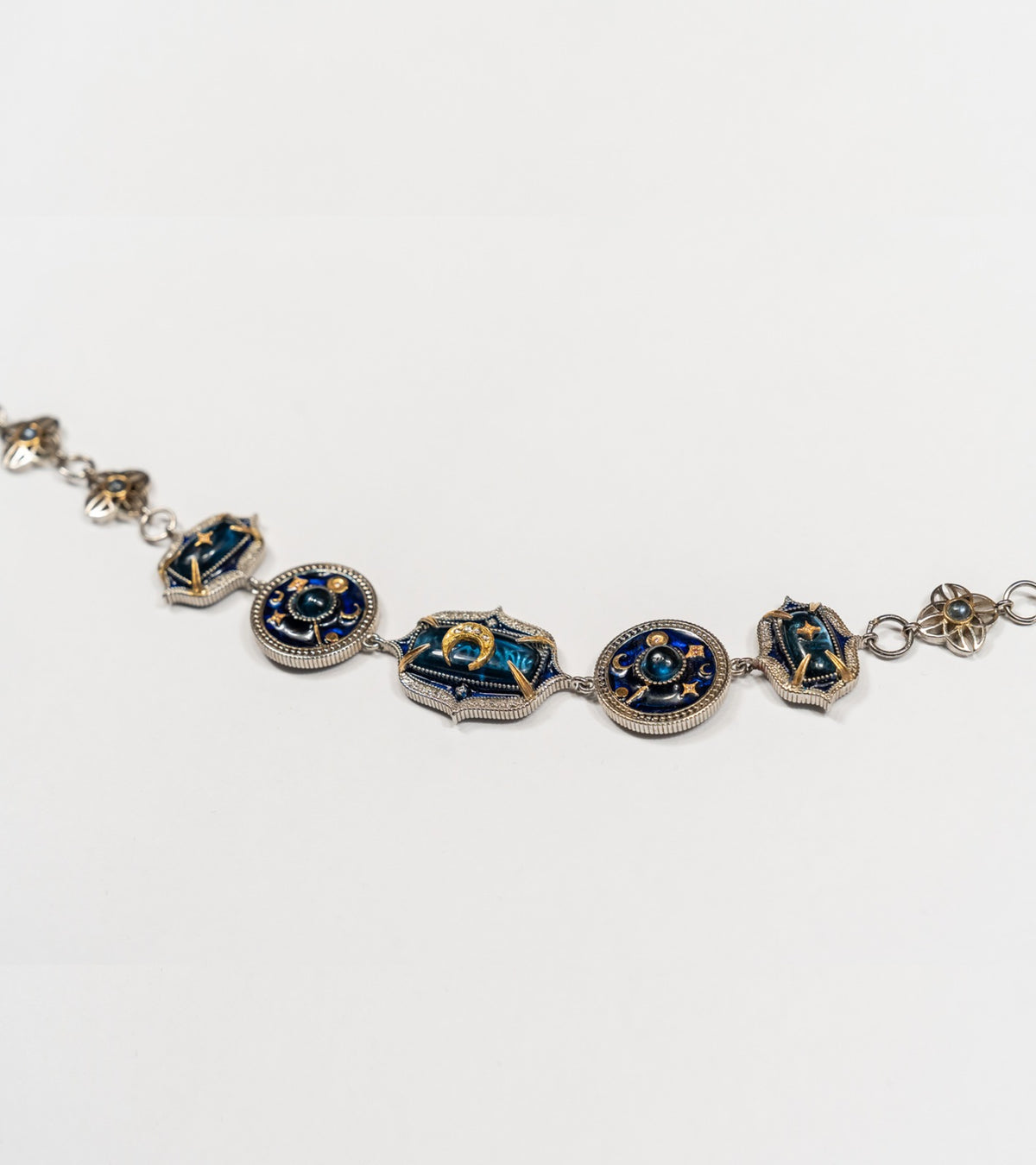 Taskan Choker in silver with 18K and 22K gold, kyanite, Polki diamonds, and hand-painted blue enamel