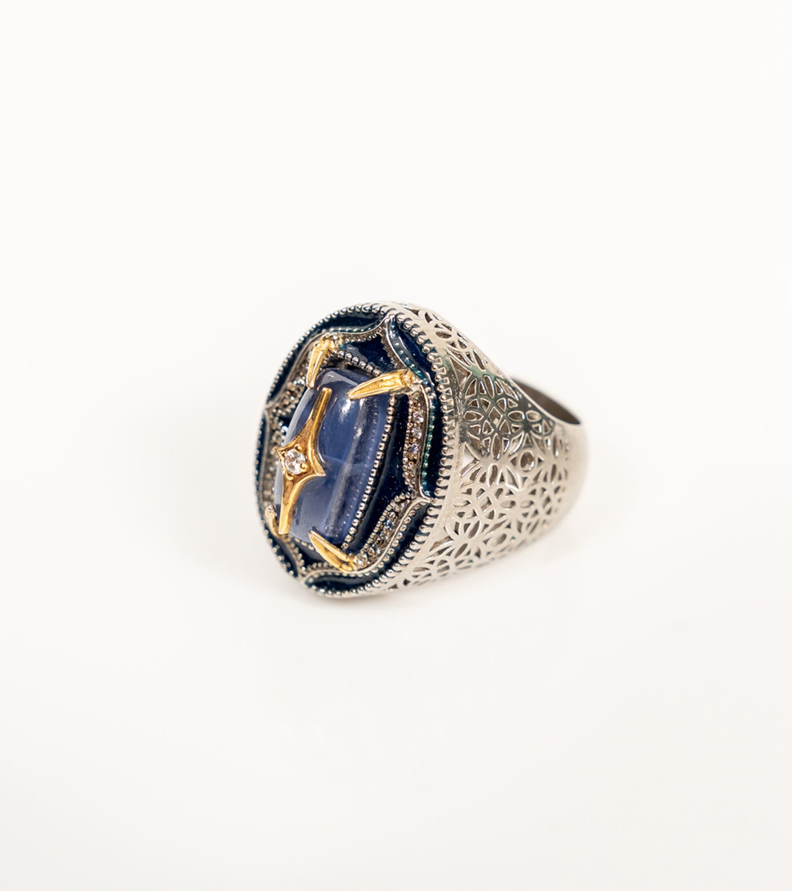 kyanite-front.jpg	Taskan Ring in blue kyanite with hand-painted enamel, natural diamonds, sterling silver, and 18K gold in an architectural silhouette