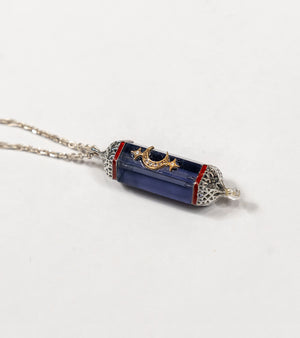 Vega Pendant with a 36.5 ct amethyst centerpiece, framed in silver with 18K gold accents and hand-painted enamel