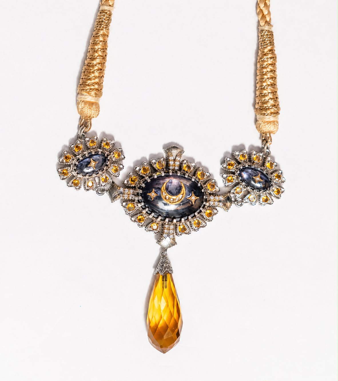 Detail of the blue hand-painted enamel work on the Virja Necklace