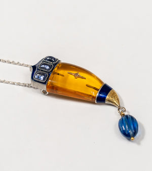 Close-up of the Vita Brooch Pendant in crafted citrine crystal, showing the warm golden stone against the sterling silver and 18K gold setting