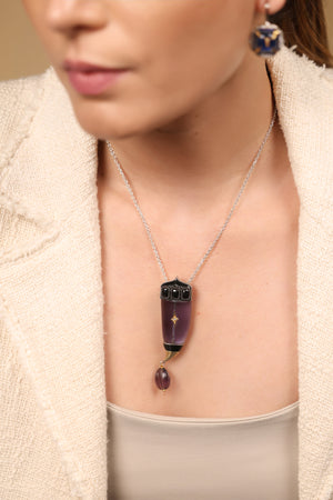 Close-up of the sculptural silhouette and amethyst crystal detailing on the Vita Brooch Pendant